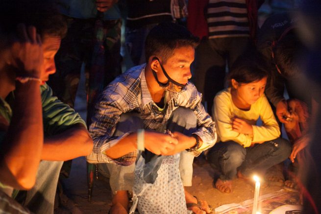 A young boy entranced at the game.