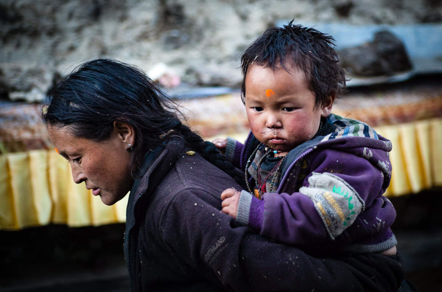 A mother and son on their way home after a Puja ceremony in the region of Manaslu Nepal.