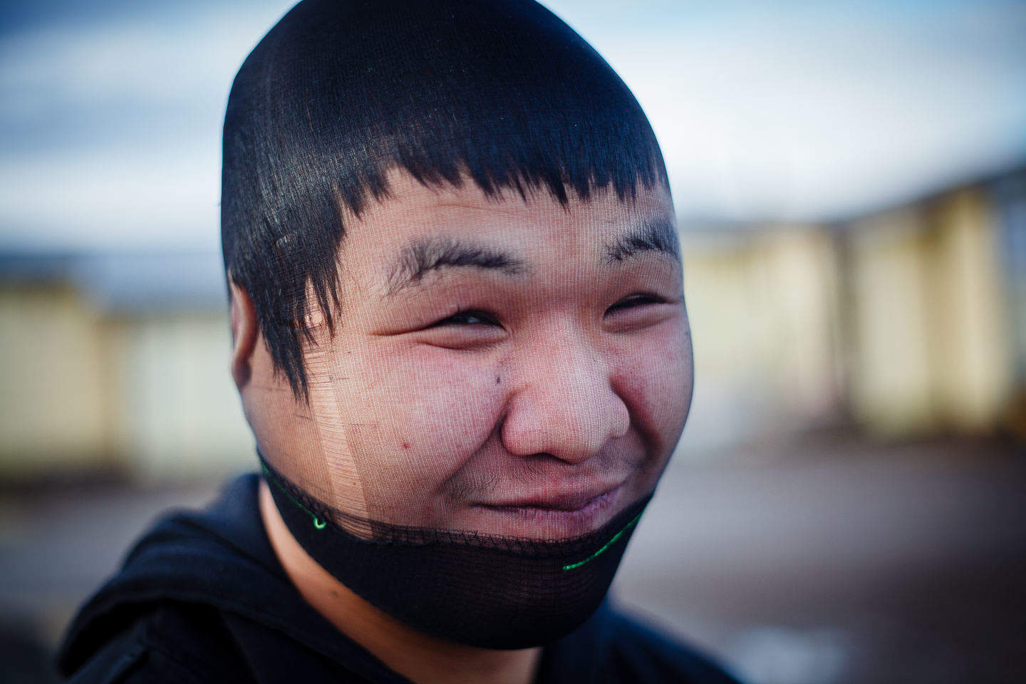 A youth playing around in the village of Kugluktuk, Canada.